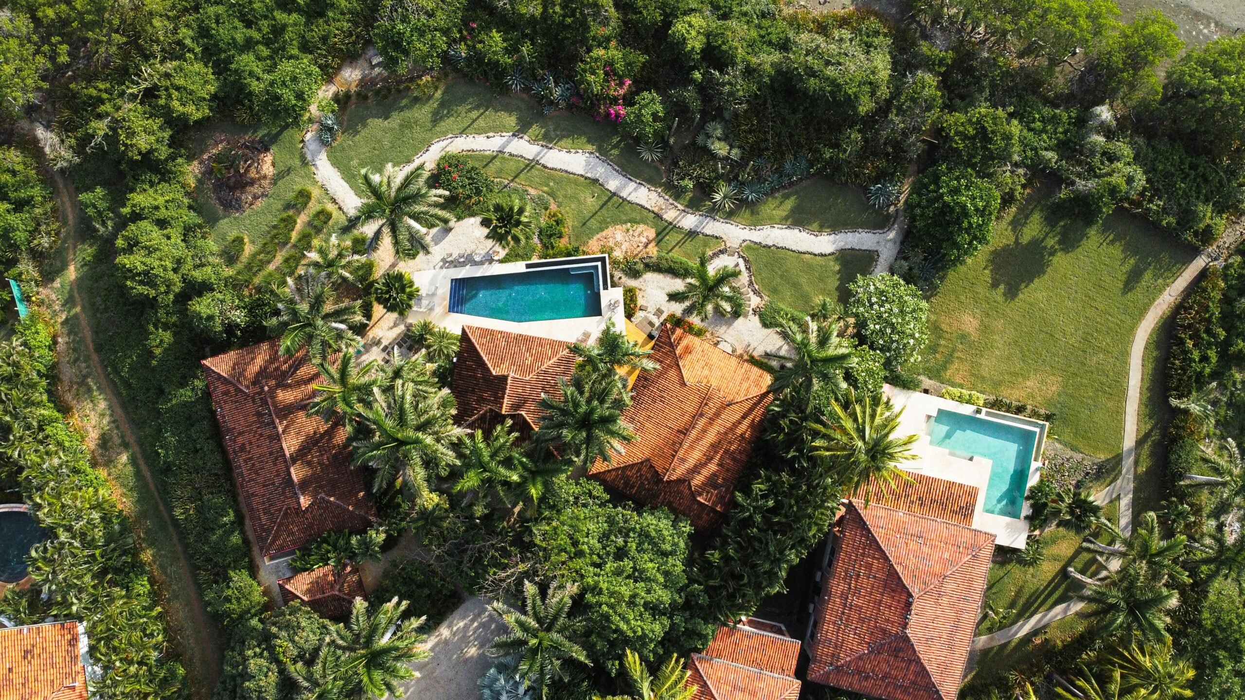 Waterfront view of luxury condos in Palm Beach showing how prime location enhances real estate value.